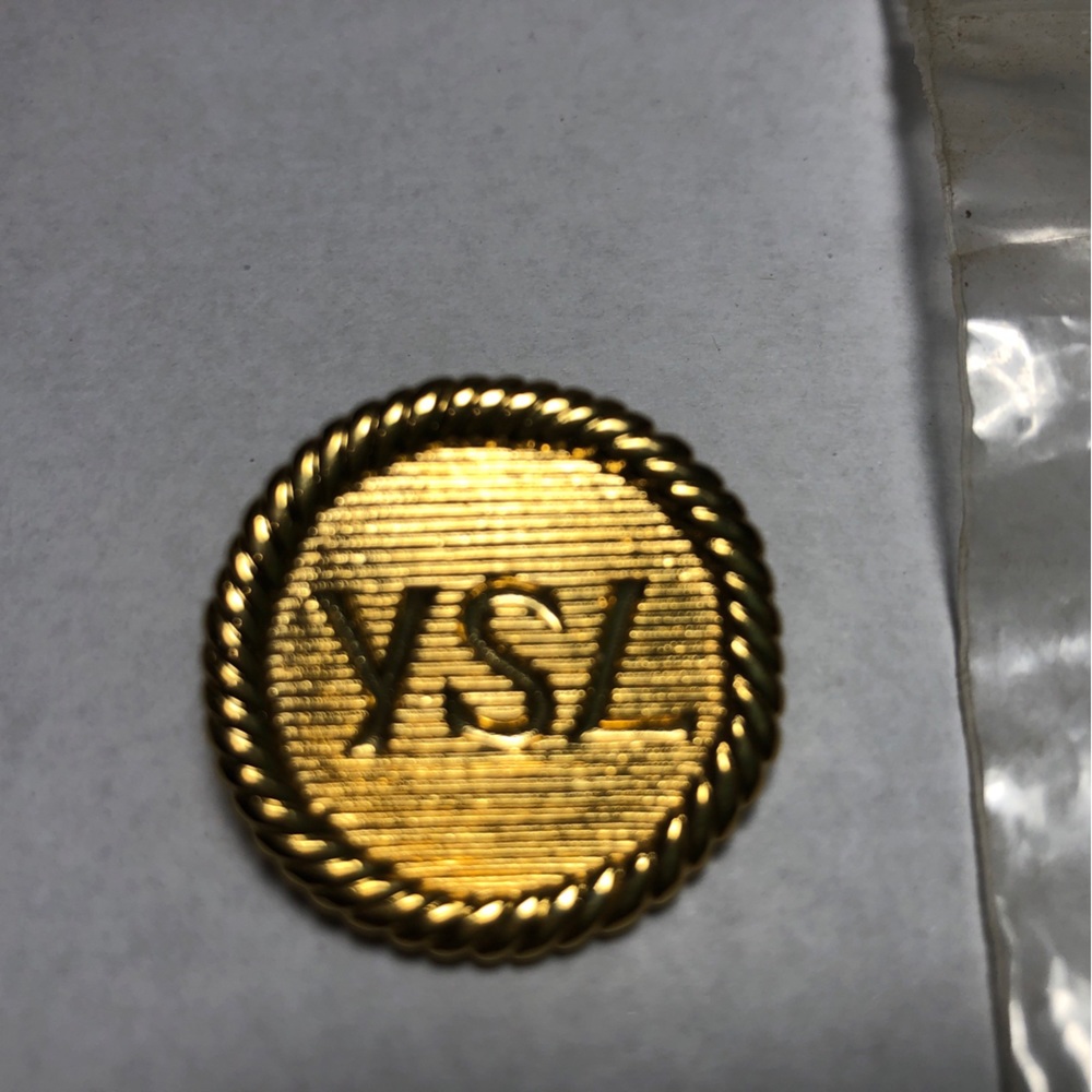 Ives saint laurent gold tone button